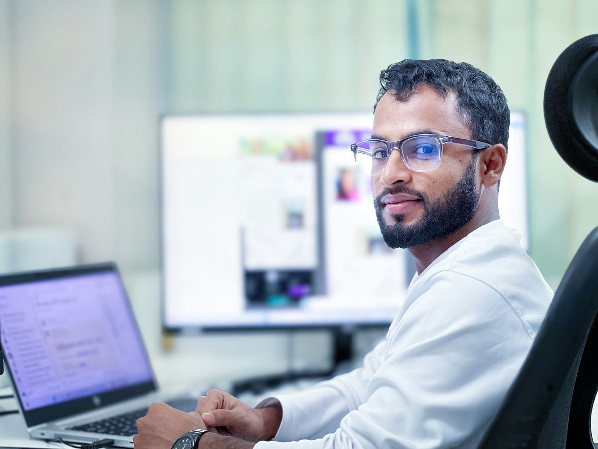 A data scientist working at a laptop.