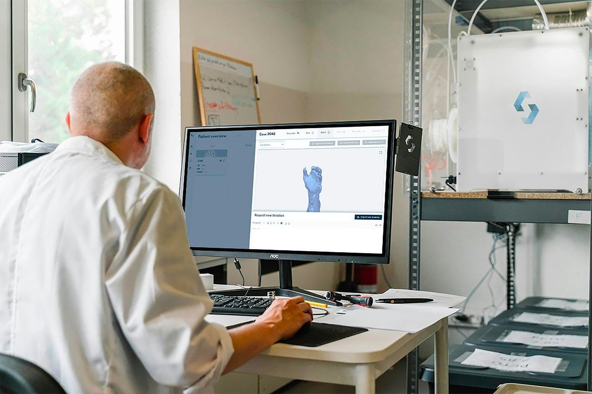 A researcher working with a 3D model on a computer.